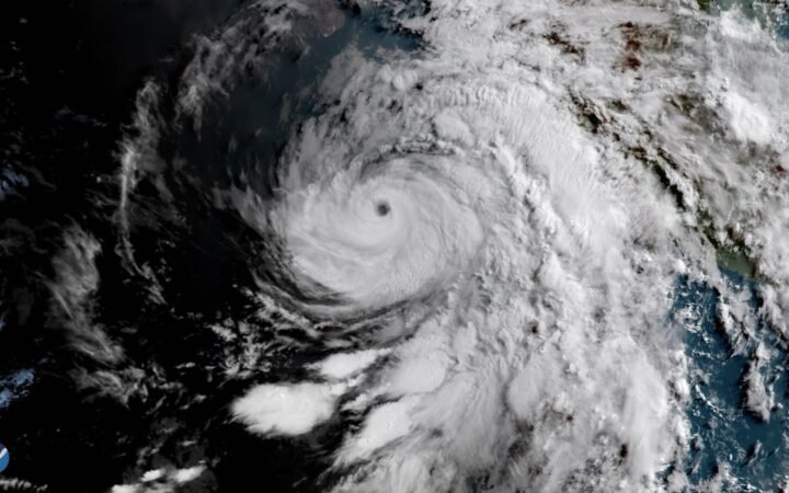 The GOES East satellite captured this image of the sun rising over Hurricane Bud in the eastern Pacific Ocean on June 12, 2018. Positioned roughly 200